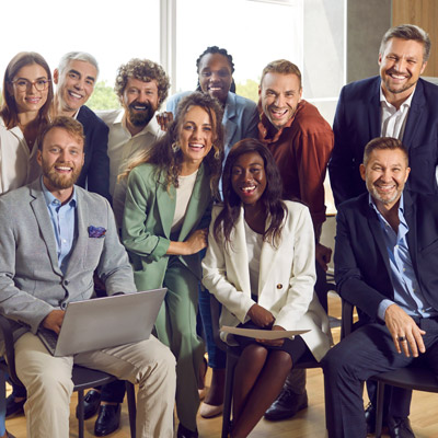 Group of professionals in a bright office, representing stakeholders involved in Oakford Group's property coordination